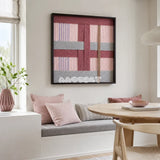 Bloom Forecast SQ095 framed fiber artwork featuring overlapping pink, mauve, and gray geometric yarn blocks.