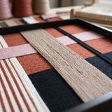 Angled studio close-up of Flower-Bed Secrets SQ100 highlighting dimensional soft cotton cord craftsmanship.