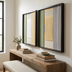 Two framed Sun-Baked hand-woven textile pieces styled perfectly above a long wooden entryway console table, creating a serene and cohesive decor look.