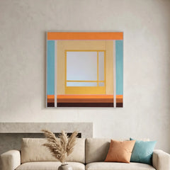 Large hand-woven wool wall art in warm orange and teal tones displayed above a cream sofa with pampas grass decor.