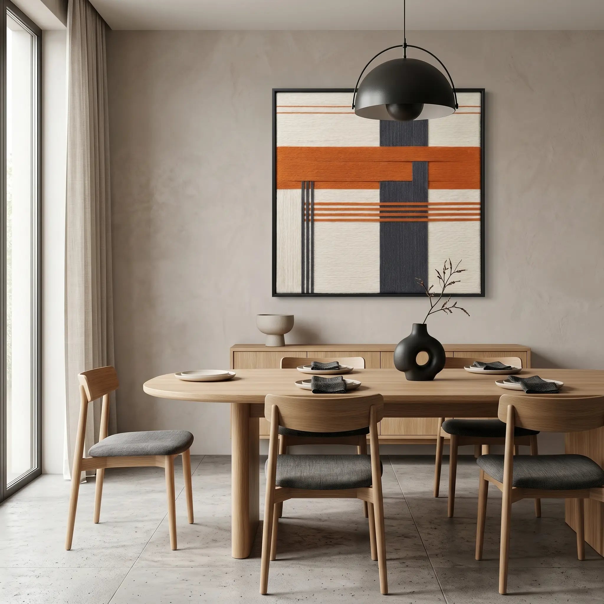 Vibrant geometric wool tapestry styled as a bold focal point in a contemporary dining room above a light wood sideboard and dining table.