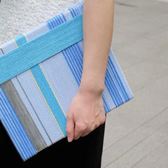 Diagonal close-up of That Summer, the Blue Sea yarn art highlighting tight stitch detail and smooth color transitions