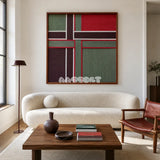 The Gift Ribbon geometric yarn wall art displayed above a curved cream sofa in a bright modern living room.