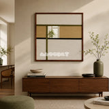 Through the Mirror cream, tan, olive, and black yarn-framed mirror displayed above a walnut console in a sunlit modern living room.