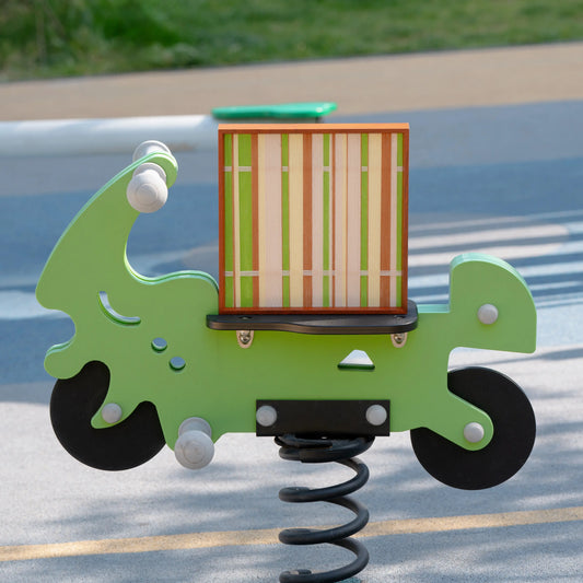 Tree Ah Tree yarn woven wall art mounted on a green playground spring rider in park setting