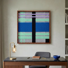 Winter Aurora textured fiber wall art styled in a contemporary home office, hanging above a sleek desk with a brass lamp.