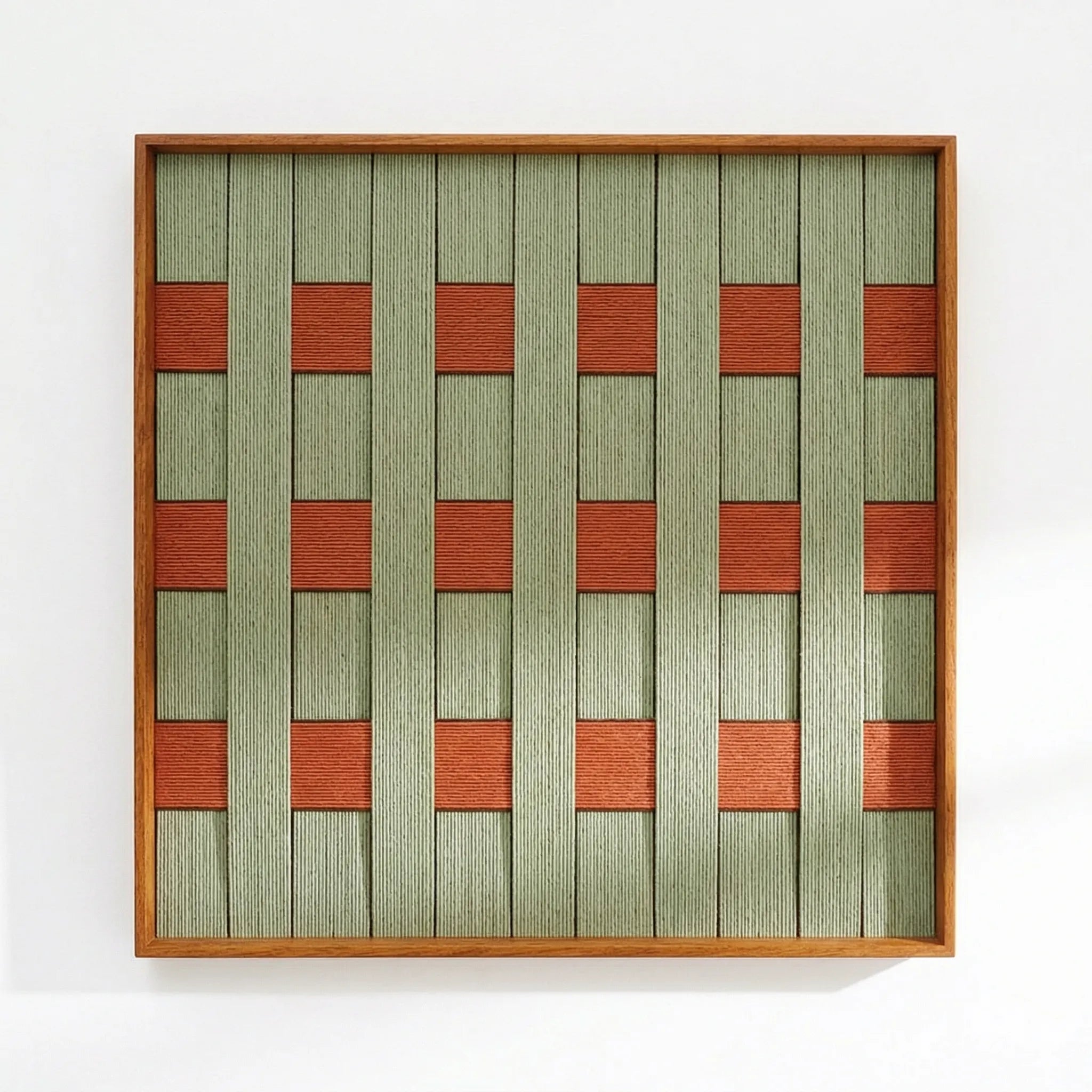 Direct front view of the hand-woven wool tapestry showing the intricate textured weave and geometric pattern in a light wood frame.