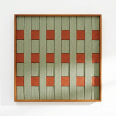 Direct front view of the hand-woven wool tapestry showing the intricate textured weave and geometric pattern in a light wood frame.