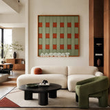 A Wrapped Afternoon geometric yarn wall art displayed above a white sofa with a green accent chair in a contemporary living room.
