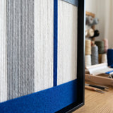 Detailed view of the vibrant blue soft cotton cord section and black metal frame of the Absolute Zero textured fiber wall art.