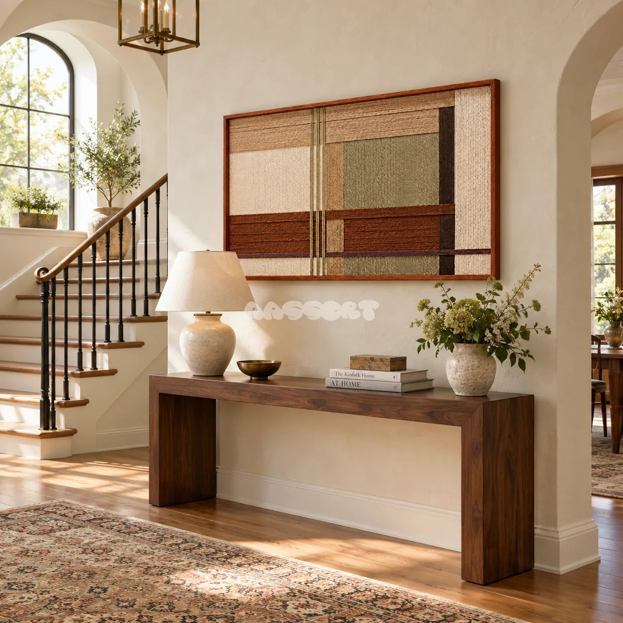 Amber Meadow RE090 framed fiber wall art above a walnut console in a sunlit neutral entryway