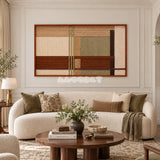 Amber Meadow RE090 geometric fiber wall art displayed above a curved cream sofa in an elegant living room