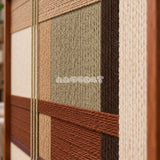Close-up of Amber Meadow RE090 showing layered soft cotton cord in sage, cream, amber brown and dark brown