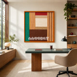 Autumn Breeze geometric yarn wall art displayed above a desk in a bright modern home office.