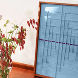 Angled view of Blue Bridge Over the Pond yarn wall art emphasizing the textured surface and crisp transitions between grid and panel areas

