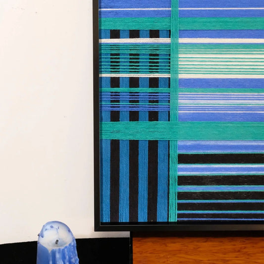 Close-up of Blues Harmony yarn art revealing tight looped wool texture and crisp transitions between navy and sky blue stripes

