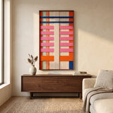 California Rhythm framed hand-woven wall art hanging above a dark wooden sideboard in a sunlit living room setting.