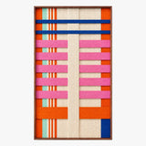 Frontal studio shot of the California Rhythm rectangular hand-woven wool tapestry with bold geometric patterns in a frame.