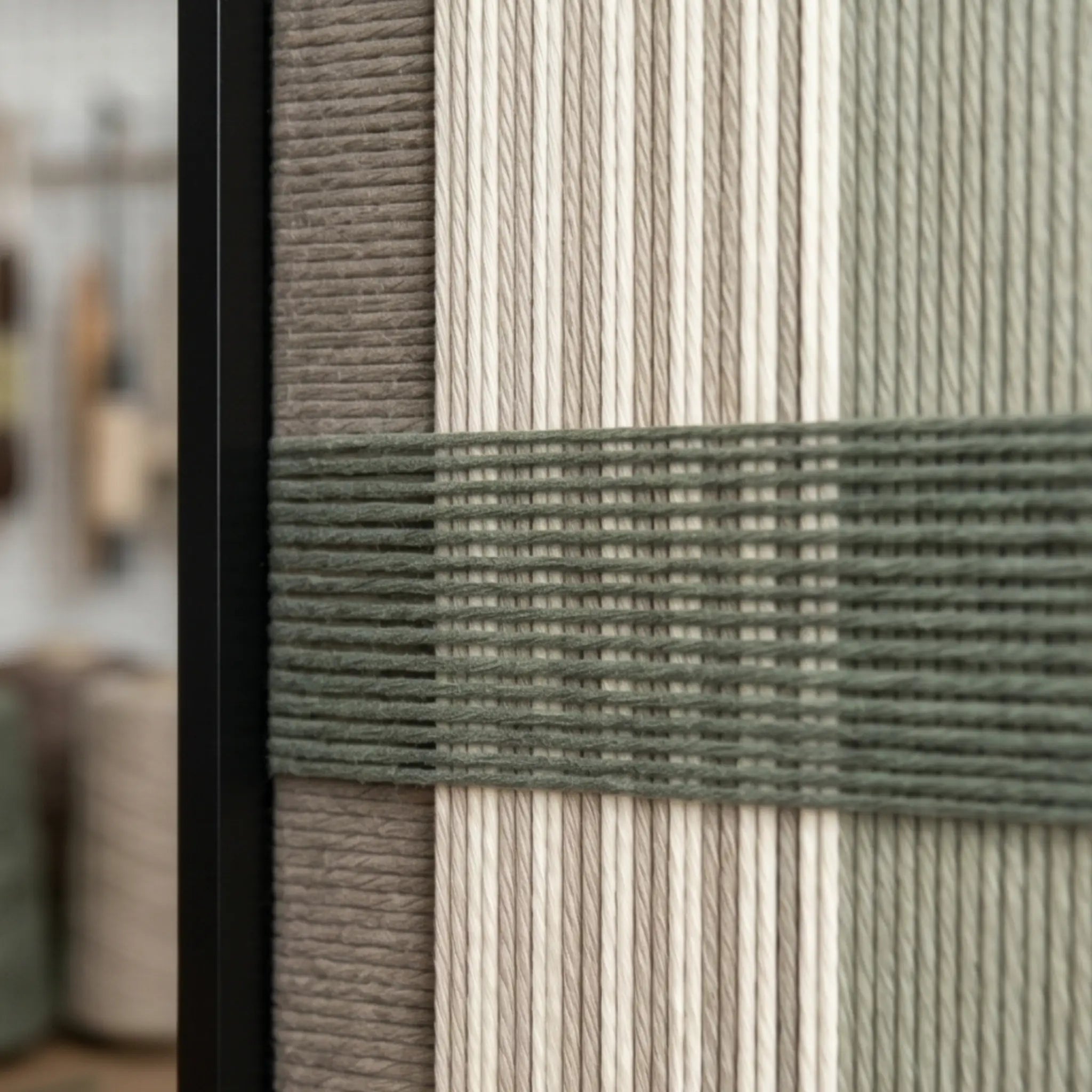 Detailed macro close-up of the Celadon Mist hand-woven textile art highlighting the textured sage green horizontal yarn crossing over cream and grey vertical stripes.