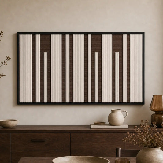 Earth-toned geometric hand-woven wool tapestry beautifully staged in a warm room, hanging over a rustic wooden sideboard.