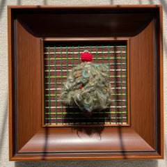 Direct front view of the mahogany-toned frame enclosing the textured Christmas tree art against a dark grid background with cast shadows.