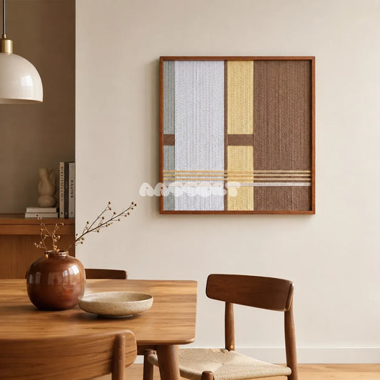 Diluted Solitude gray yellow and brown textile wall art displayed above a wood table in a warm natural dining room.
