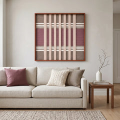Sophisticated Dusty Tones hand-woven tapestry hanging above a modern sofa in a bright living room with soft earth-toned decor.