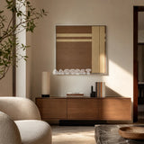 Earth’s Embrace chocolate brown and sand cream geometric yarn wall art displayed above a wood sideboard in a sunlit reading room.