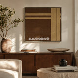 Earth’s Embrace earthy geometric yarn wall art displayed above a dark wood sideboard in a warm neutral living room.