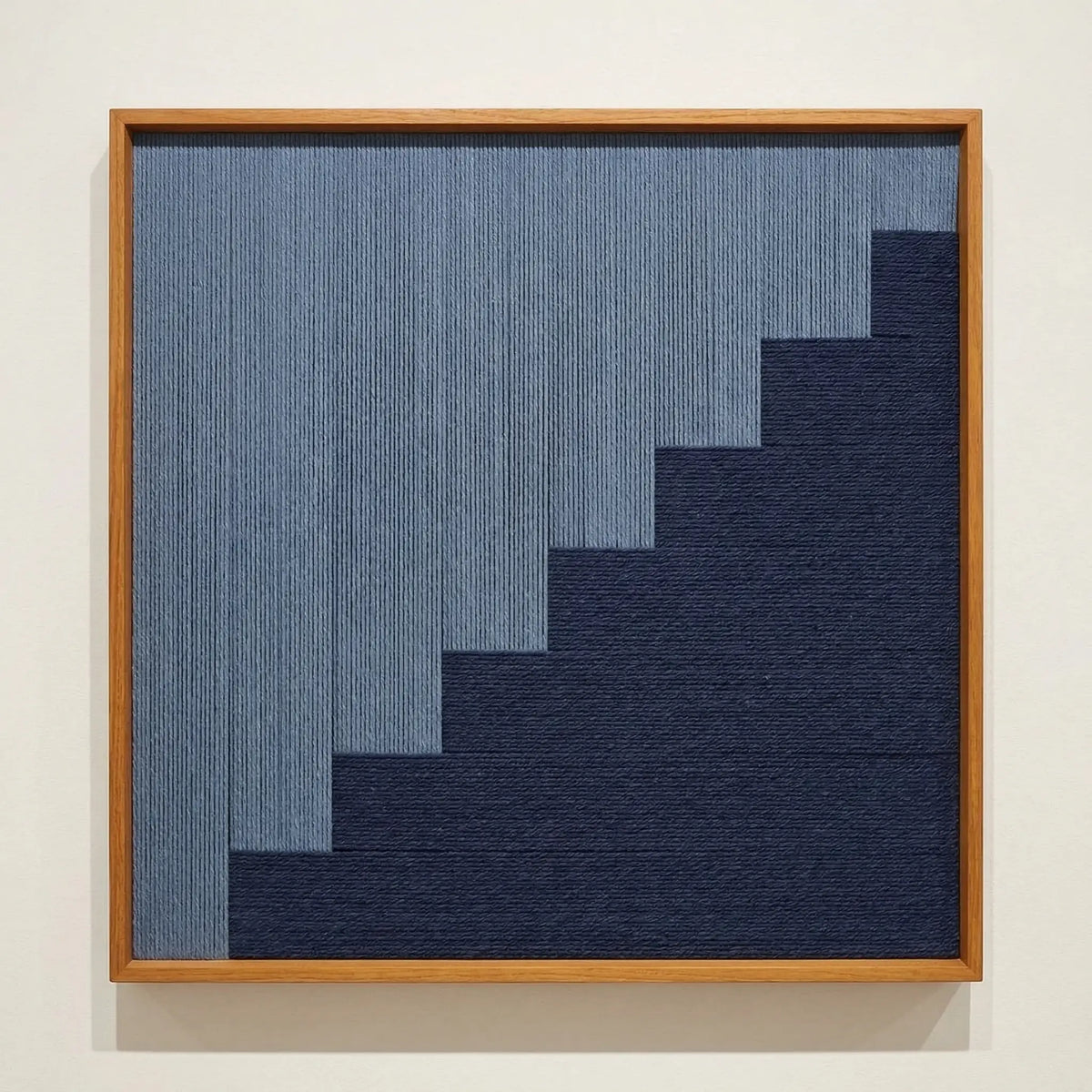 Direct front view of The Eighth Level soft cotton cord fiber artwork in a wooden frame, showcasing the tiered geometric weave and fiber texture.