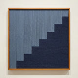 Direct front view of The Eighth Level soft cotton cord fiber artwork in a wooden frame, showcasing the tiered geometric weave and fiber texture.