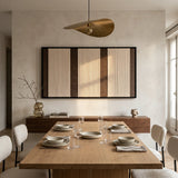 The Eternal Colonnade hand-woven wool tapestry hangs elegantly above a wooden dining table, creating a serene and sophisticated dining room atmosphere.