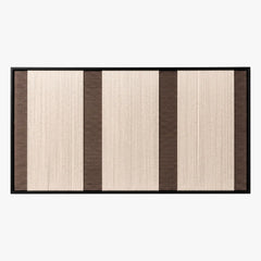 Frontal studio shot of the Eternal Colonnade rectangular hand-woven tapestry, showing cream and dark brown geometric stripes in a black frame.