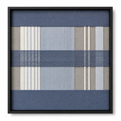 Frontal studio shot of the Foggy Pier square hand-woven textile wall art featuring blue, grey, and cream geometric plaid patterns in a black frame.