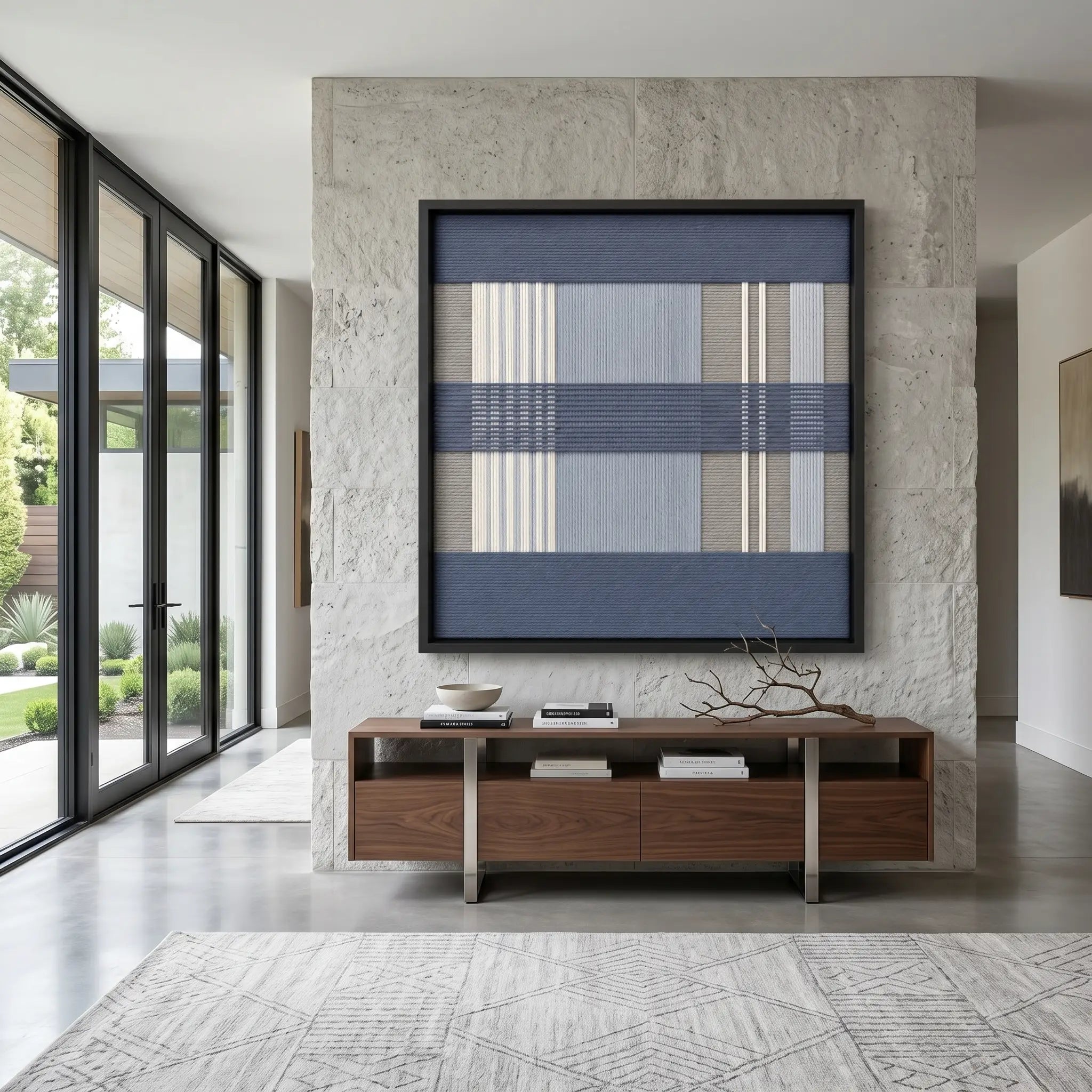 Framed Foggy Pier textile wall art displayed on a textured concrete wall, hanging above a low wooden console in a bright, modern living space.