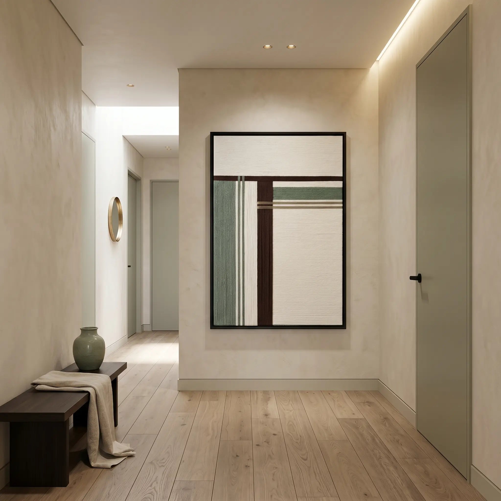 Vertical hand-woven wool wall art displayed at the end of a modern hallway, creating a sophisticated focal point in a minimalist home.