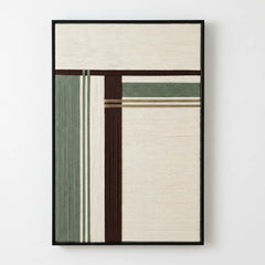Frontal studio shot of Forest Ruins hand-woven wool wall art featuring sage green, dark brown, and cream geometric patterns in a black frame.
