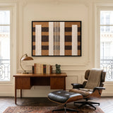 The Forgotten Gateway hand-woven wool tapestry provides a sophisticated focal point above a wooden desk and leather chair in a home office.