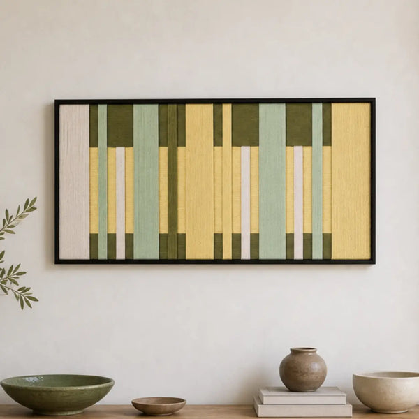 Framed Garden Interval hand-woven wall art displayed above a light wood console shelf in a serene living room setting.