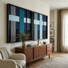 Striking Glacial Stationeries hand-woven textile art duo positioned perfectly above a wooden sideboard and next to a cozy beige sofa in a modern living space.