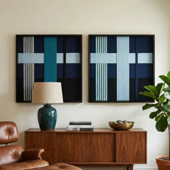 The Glacial Stationeries textile art duo styled beautifully above a dark wood mid-century sideboard with a lamp and decor in a sophisticated living room.