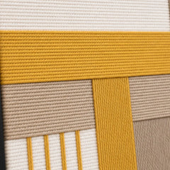 Detailed macro close-up of the Golden Interval hand-woven wool tapestry highlighting thick mustard yellow and beige textured yarn.