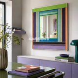 Hidden Forest colorful yarn-framed mirror displayed above a lavender cabinet in a bright modern home office.
