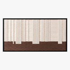 Frontal studio shot of the Ivory Rhythm hand-woven wool wall art featuring textured cream vertical lines over a solid brown base block in a black frame.