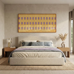 A wide interior perspective of the lavender and yellow wool tapestry hanging in a contemporary bedroom with minimalist furniture.