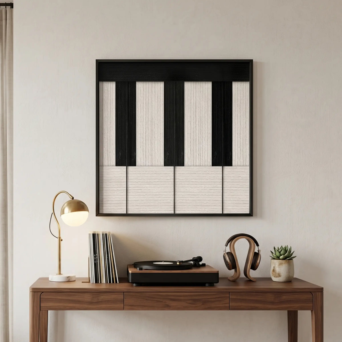 Little Black Piano soft cotton cord fiber artwork displayed above a wooden desk styled with a lamp and records in a music-themed room.