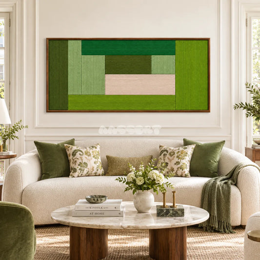 Lucerne Meadow RE061 framed fiber wall art in layered greens and pale blush above a cream sofa in a bright living room