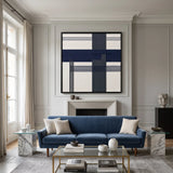 Framed Midnight Axis hand-woven wool tapestry displayed elegantly above a classic fireplace in a serene living space with blue accents.