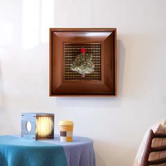 Minimalist display of the festive fiber art on a white wall near a blue table, showing how it complements modern interior decor styles.