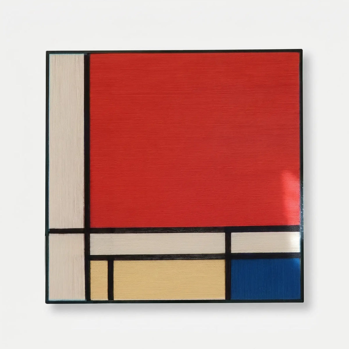 Professional studio shot of the Mondrian inspired soft cotton cord wall art in a black frame against a clean white background.